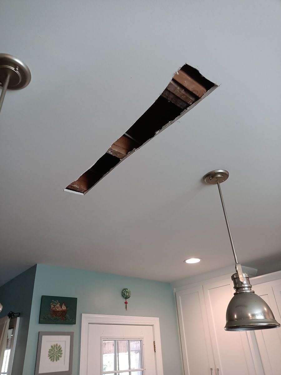 There is a hole in the ceiling in the kitchen.