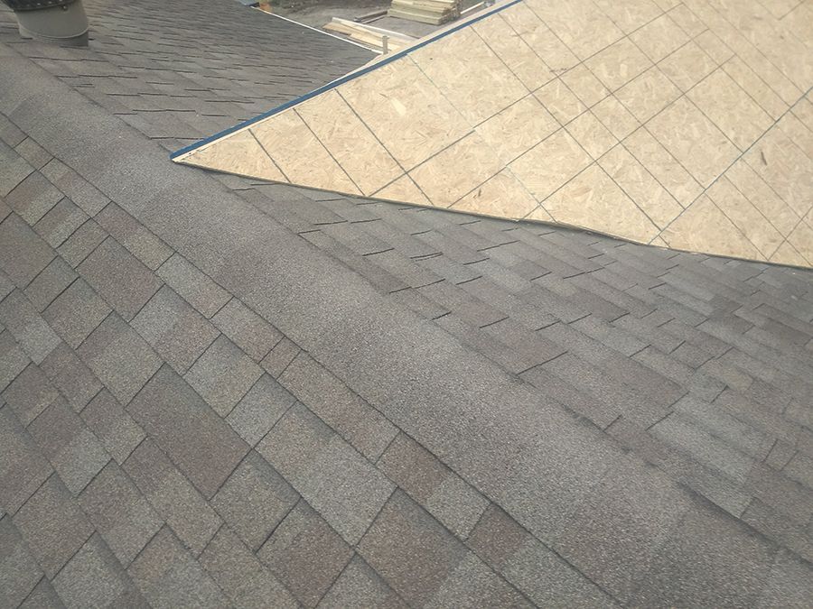 A close up of a roof with shingles on it.