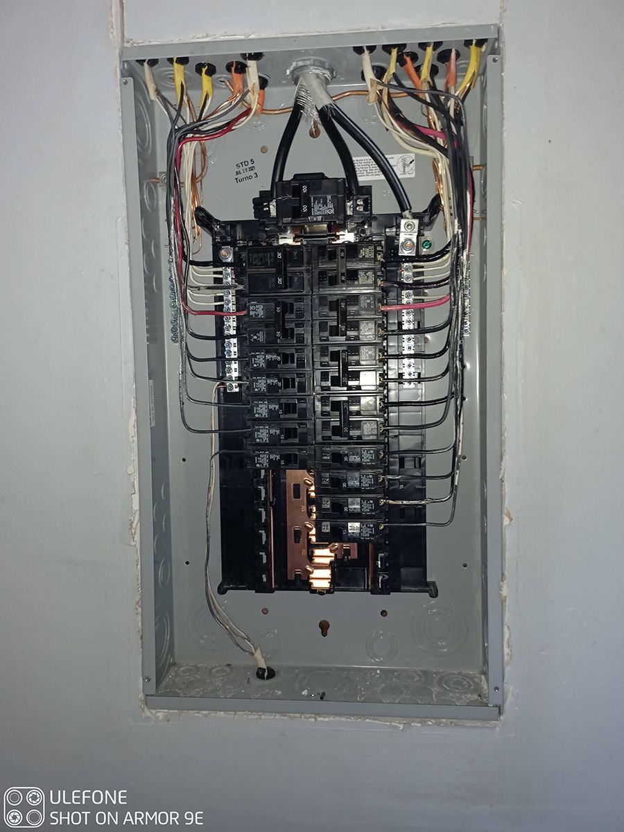 A close up of a electrical panel on a wall.