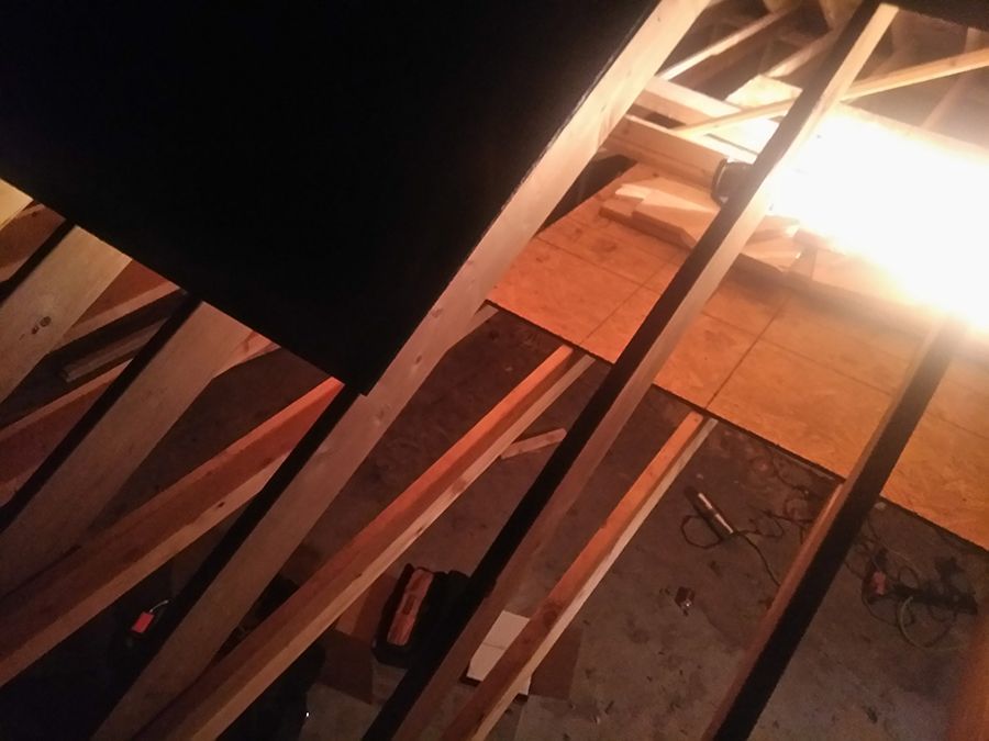 A wooden structure with a light shining through it.