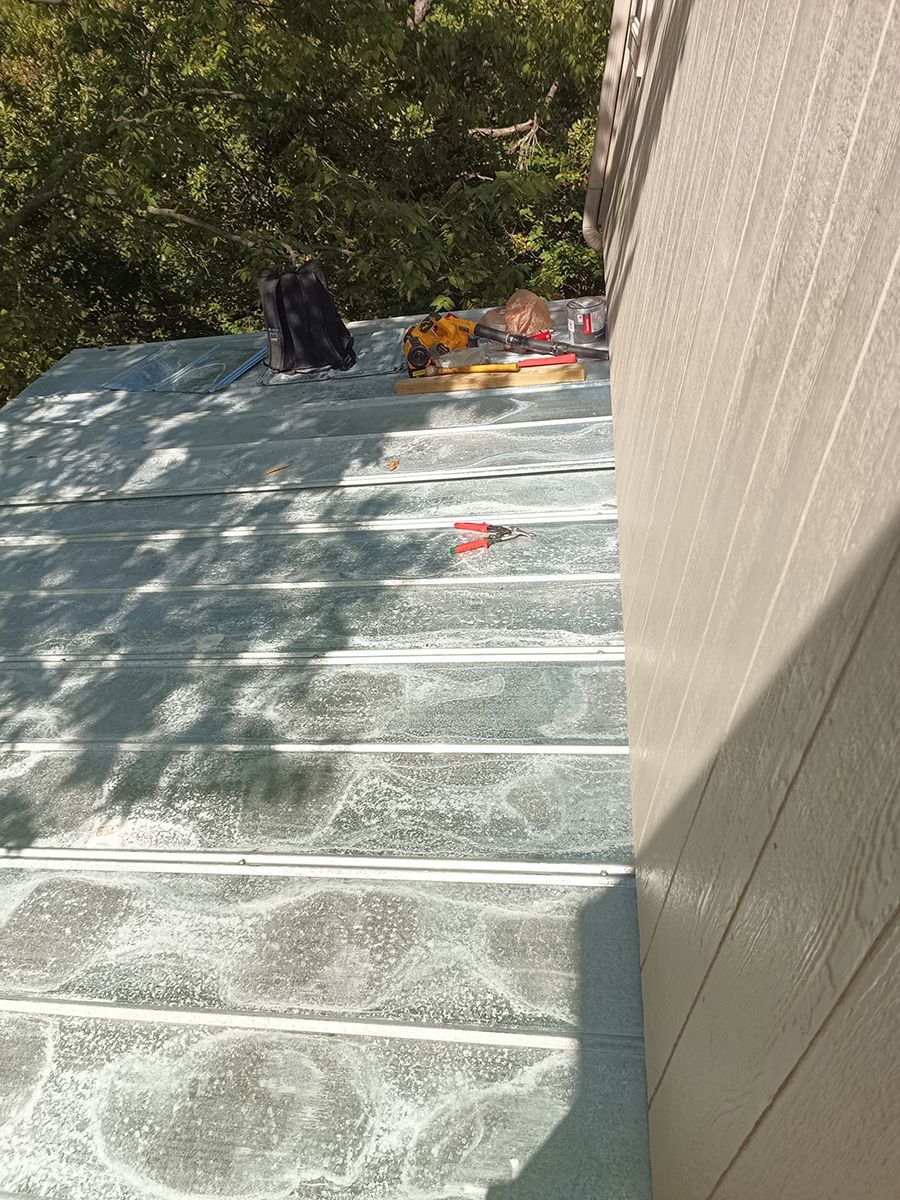 A person is standing on a staircase next to a building.
