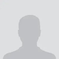 Silhouette of a person against a gray background. Shoulder-up view.