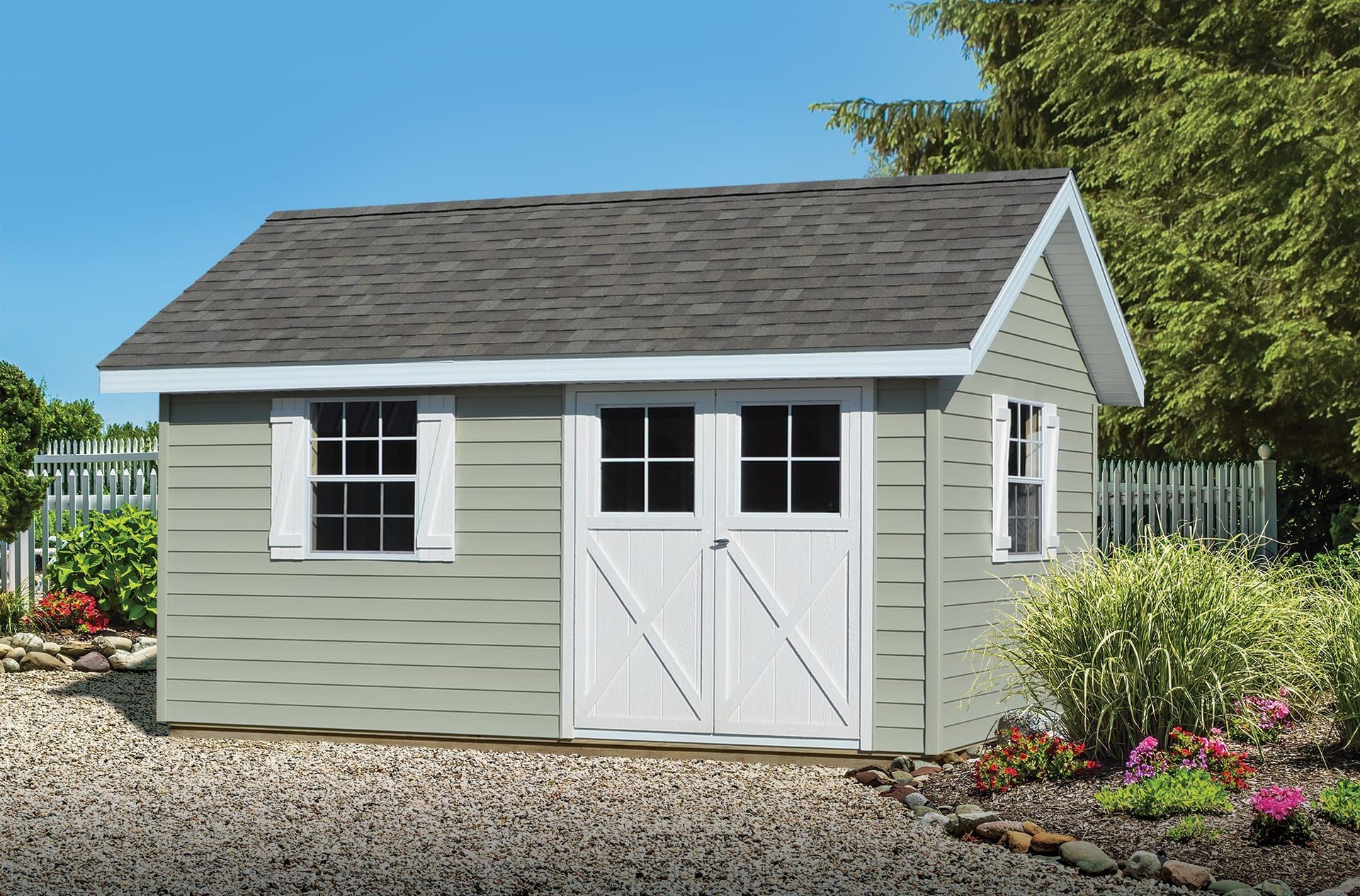 A small shed with a gray roof and white doors
