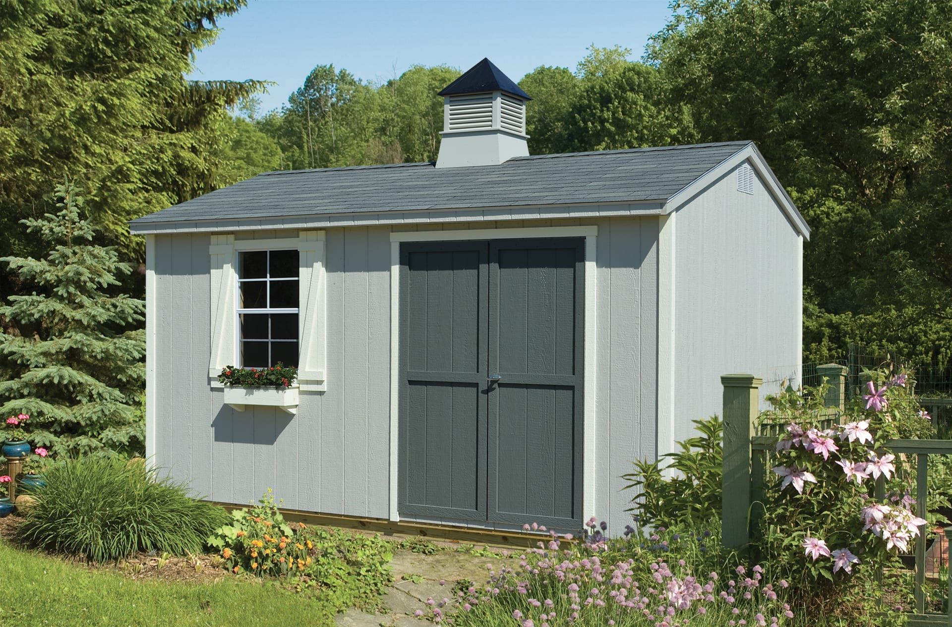 A small shed with a chimney on top of it