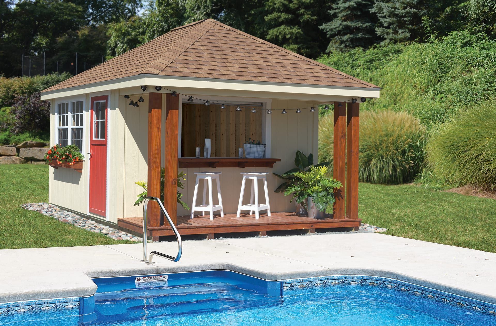 A shed with a bar next to a swimming pool