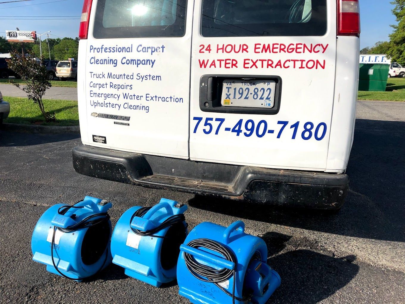 A white van that says 24 hour emergency water extraction