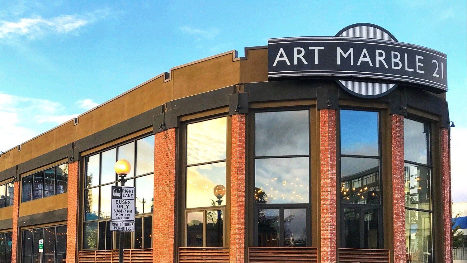A building with a sign that says art marble 21