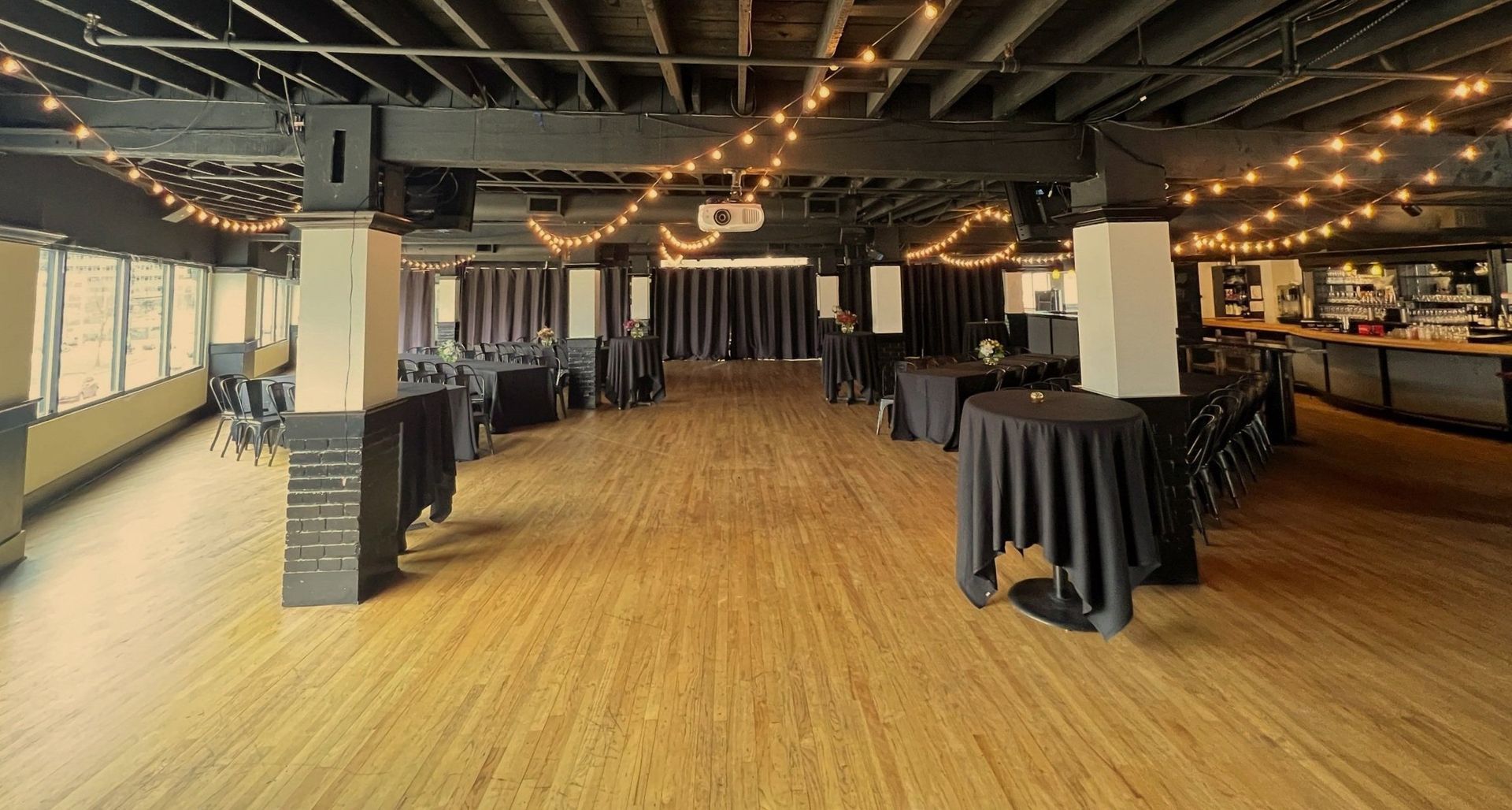 A large room with tables and chairs in it