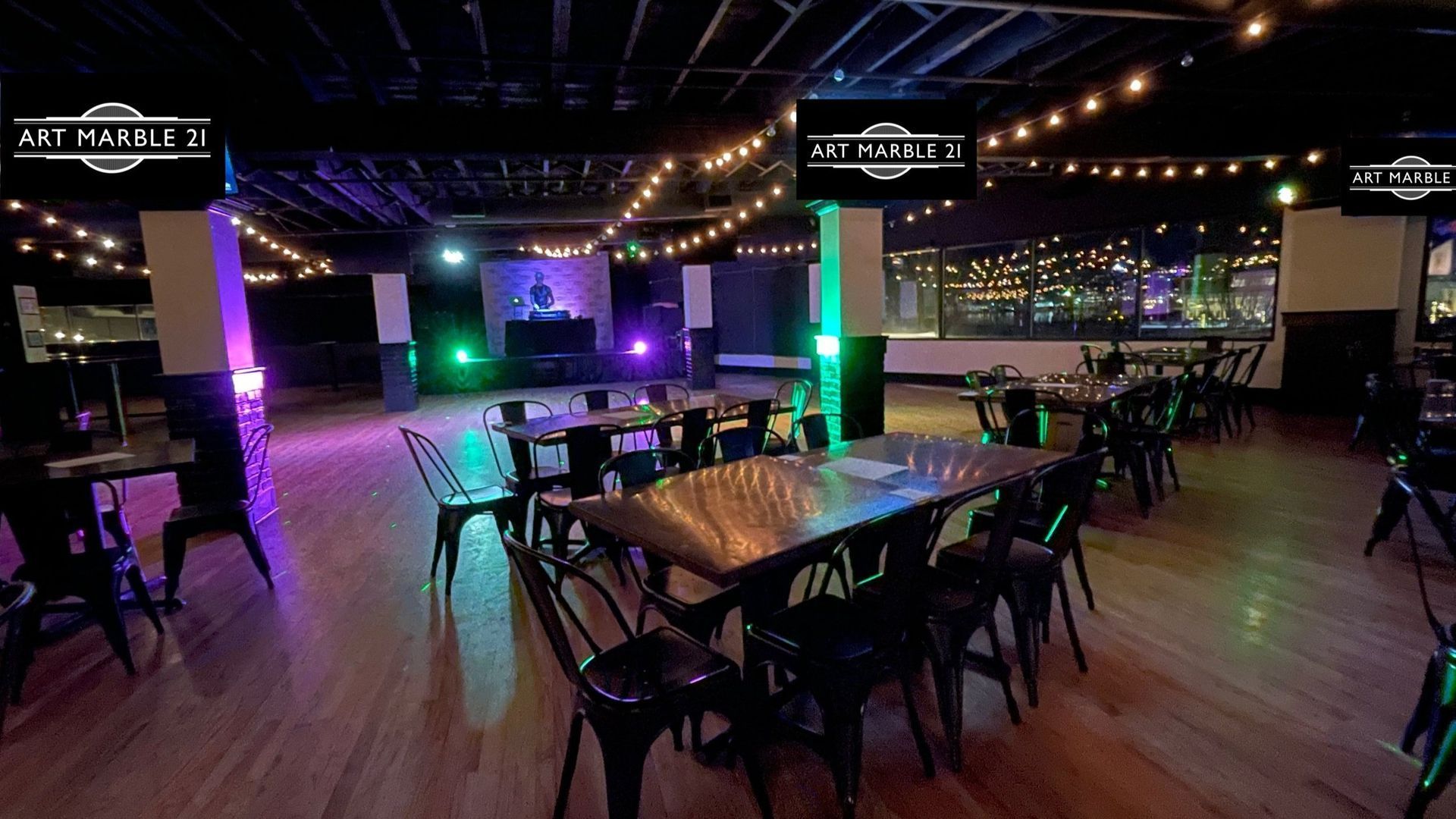 A large room with tables and chairs in it.