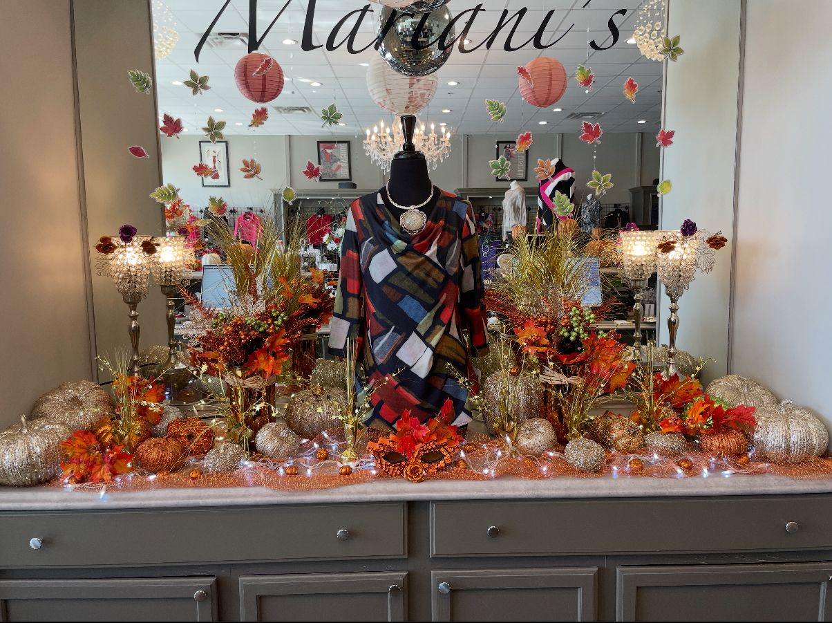 A decorated display on a dresser, with 