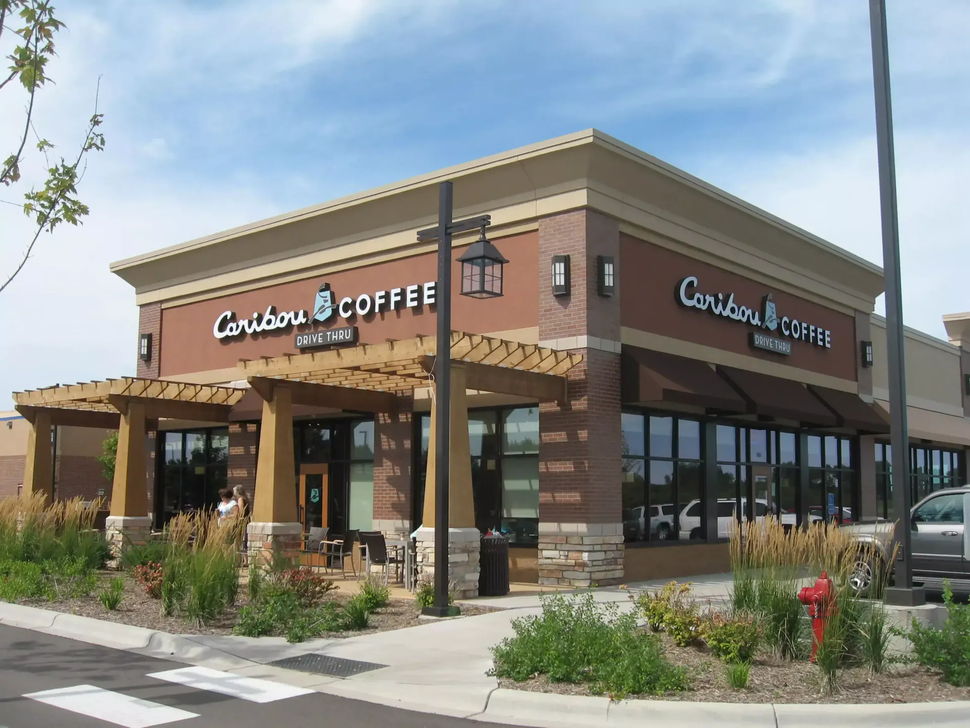 Bonefish Grill restaurant exterior with awning, sign, and street lamps.