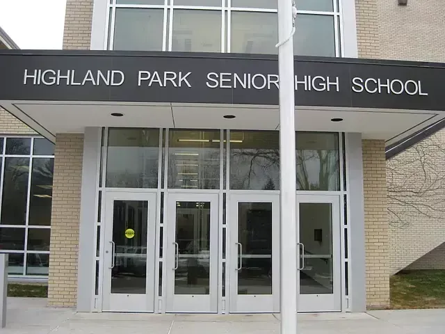 Highland Park Senior High School entrance with glass doors and a sign above.