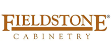 The logo for fieldstone cabinetry is brown and white.