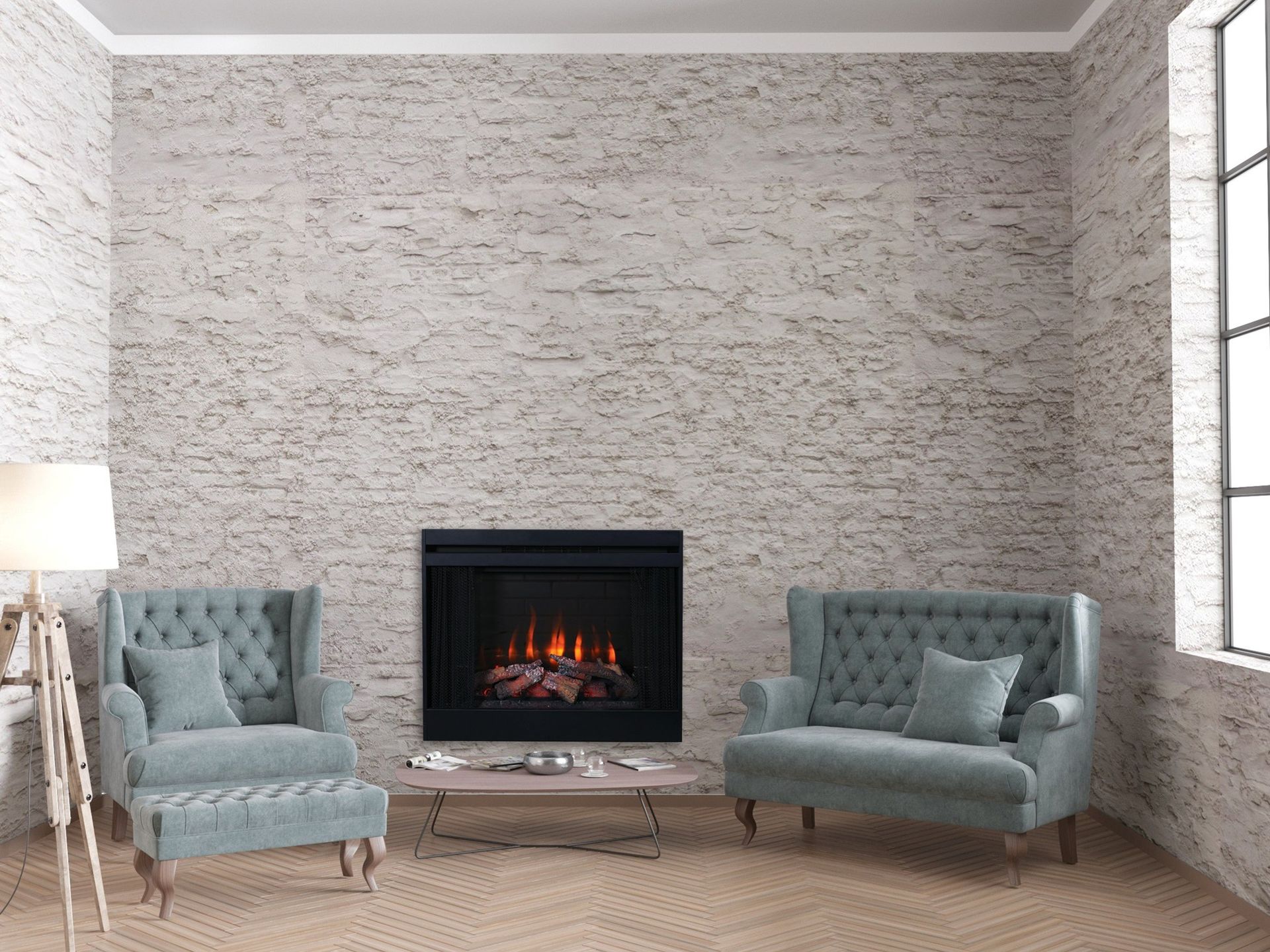 Modern living room with two blue armchairs facing a lit fireplace and a floor lamp.