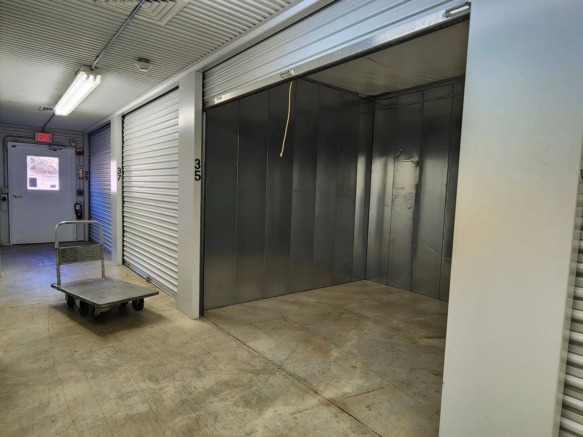 Two closed and one open interior storage units