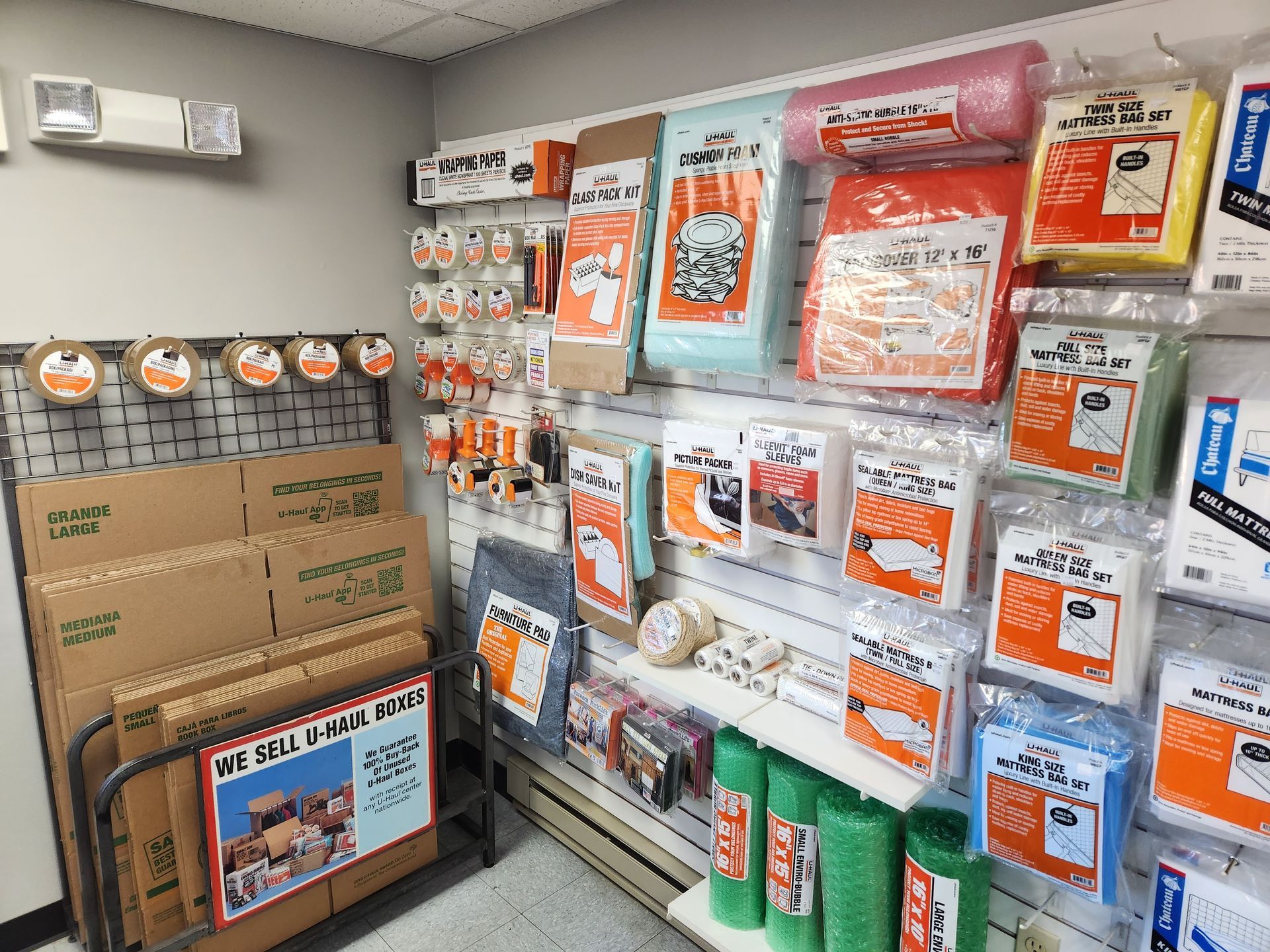 a room filled with boxes, bubble wrap, and other moving supplies