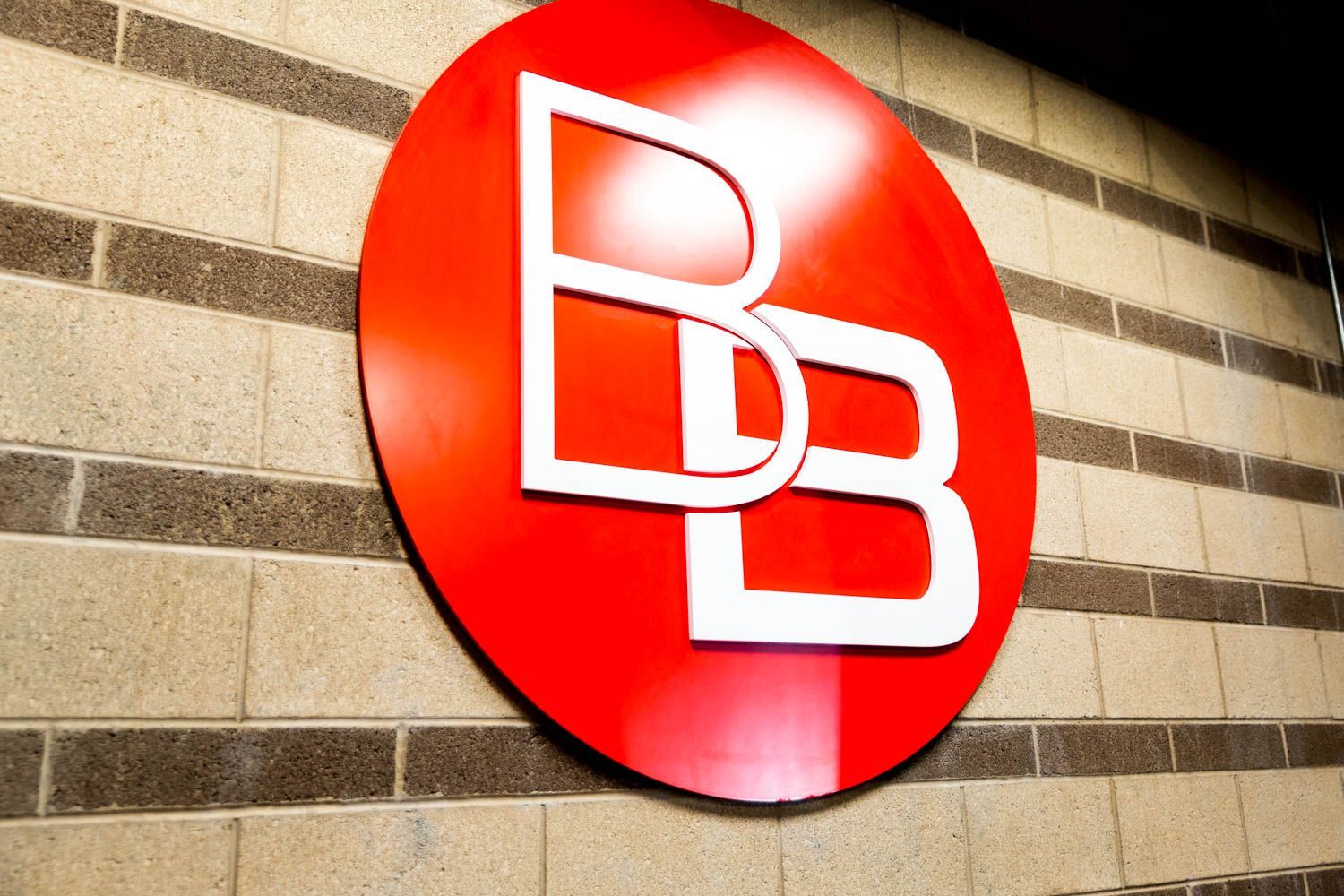 Red circular sign with white 