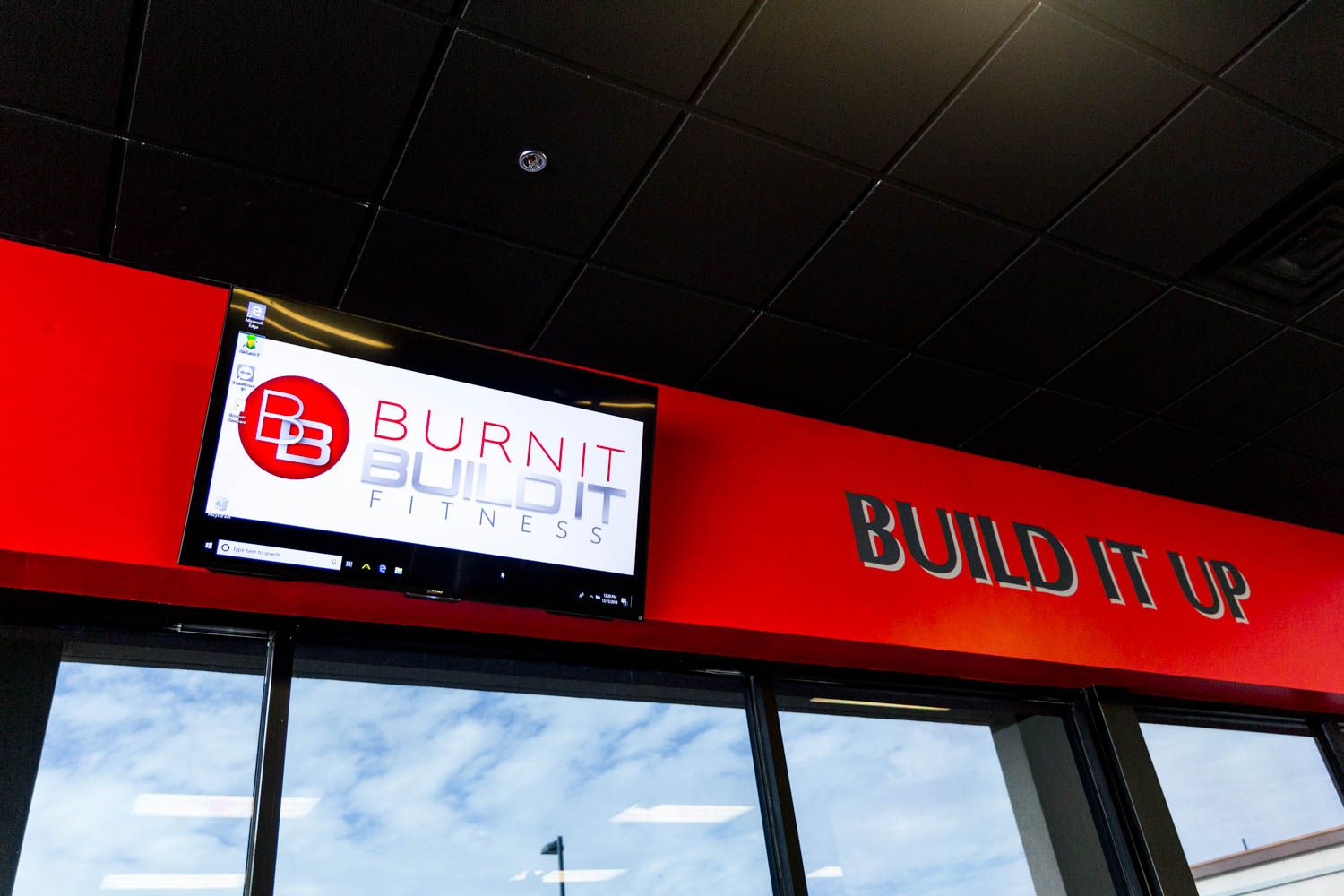 Red wall with a TV displaying 