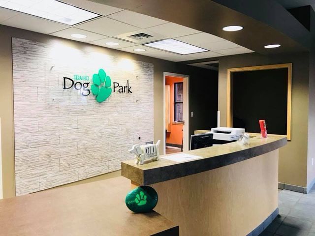 Dog Park reception desk with logo on the wall in a lobby entrance