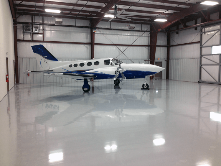 Aircraft hangars with epoxy coated floors