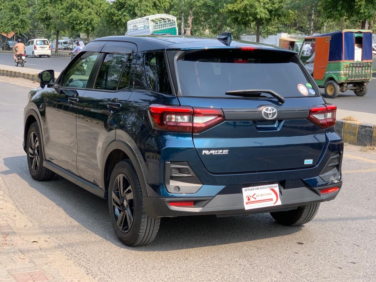 Blue Toyota Raize SUV parked on a road.