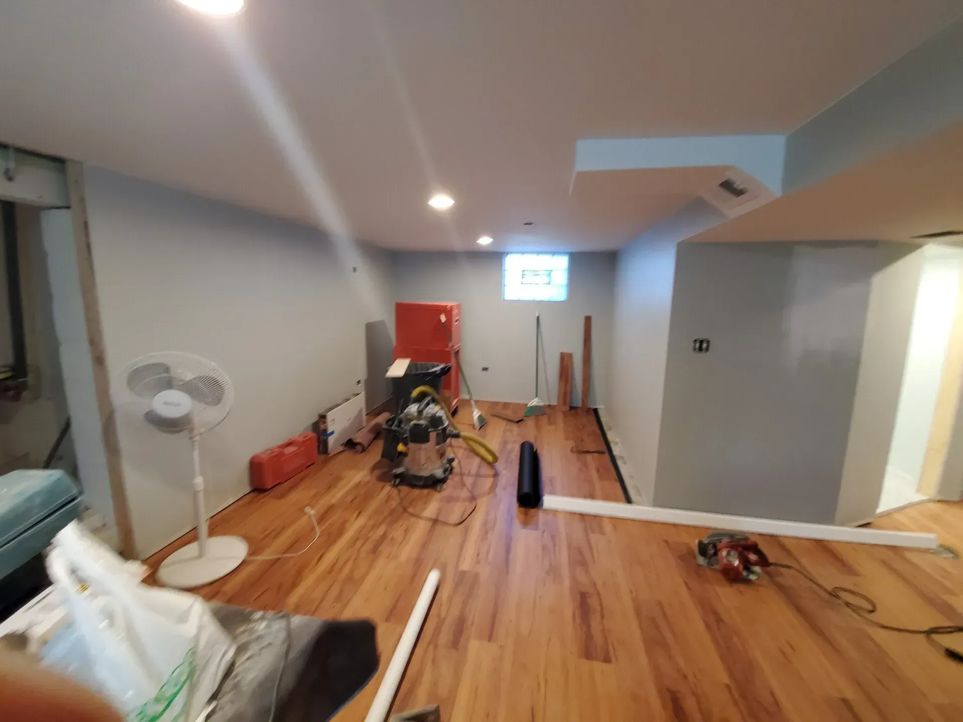 Basement with hardwood floor under renovation.