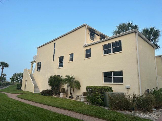 A large building with a lot of windows and stairs