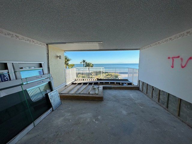 An empty room with the word tv written on the wall