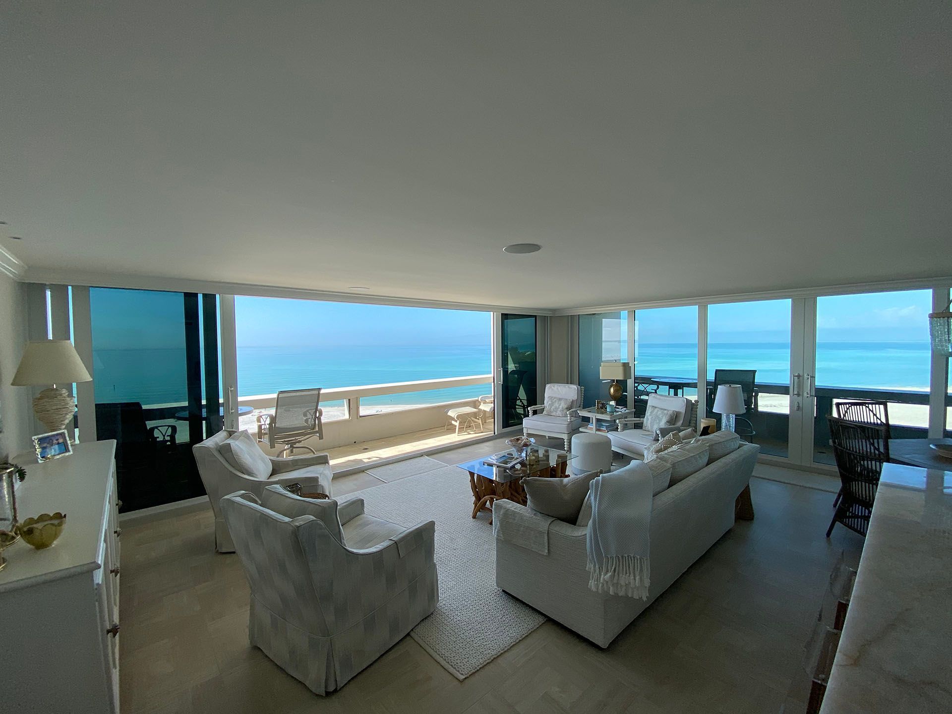 A living room with a view of the ocean