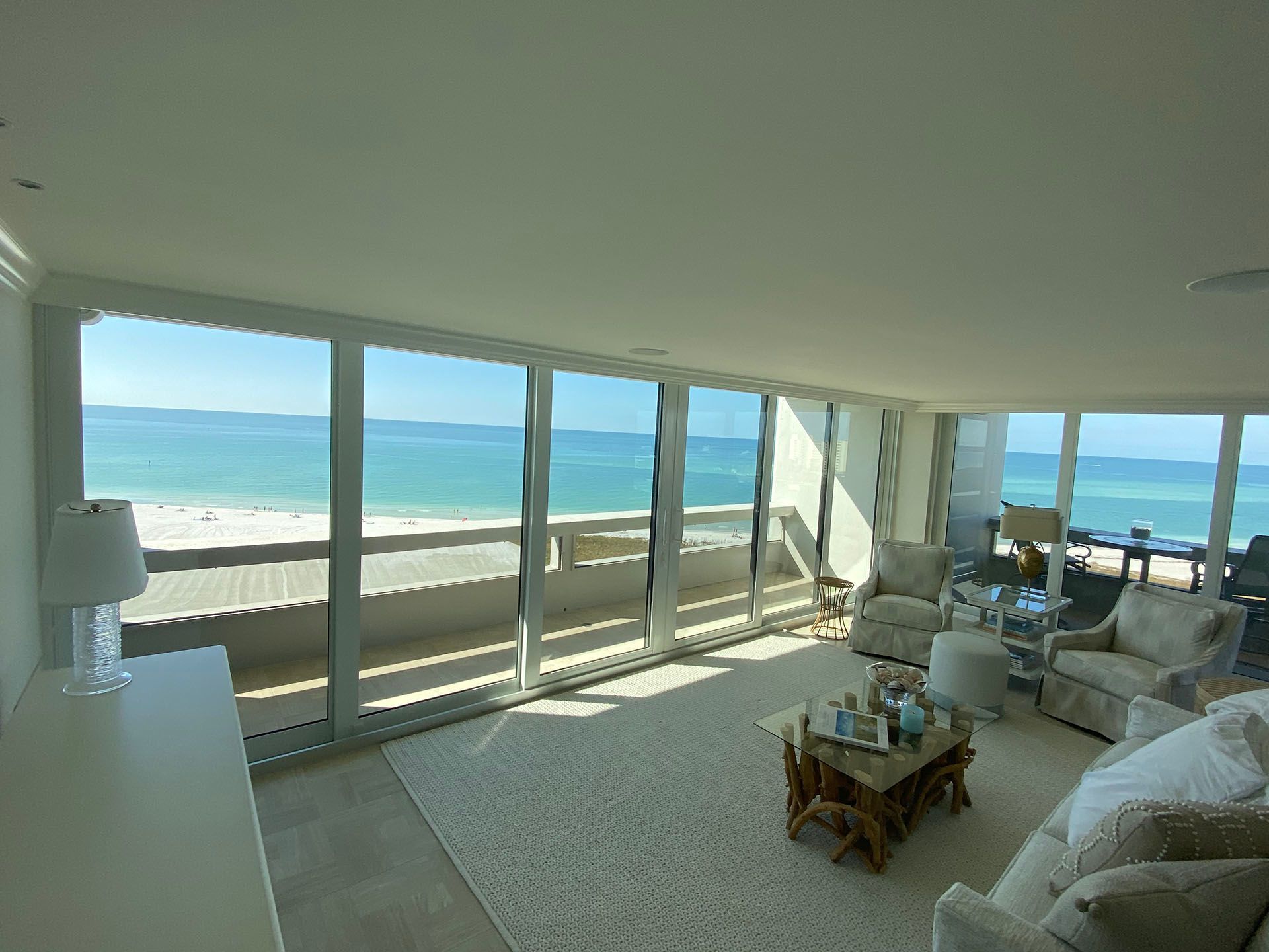 A living room with a view of the ocean