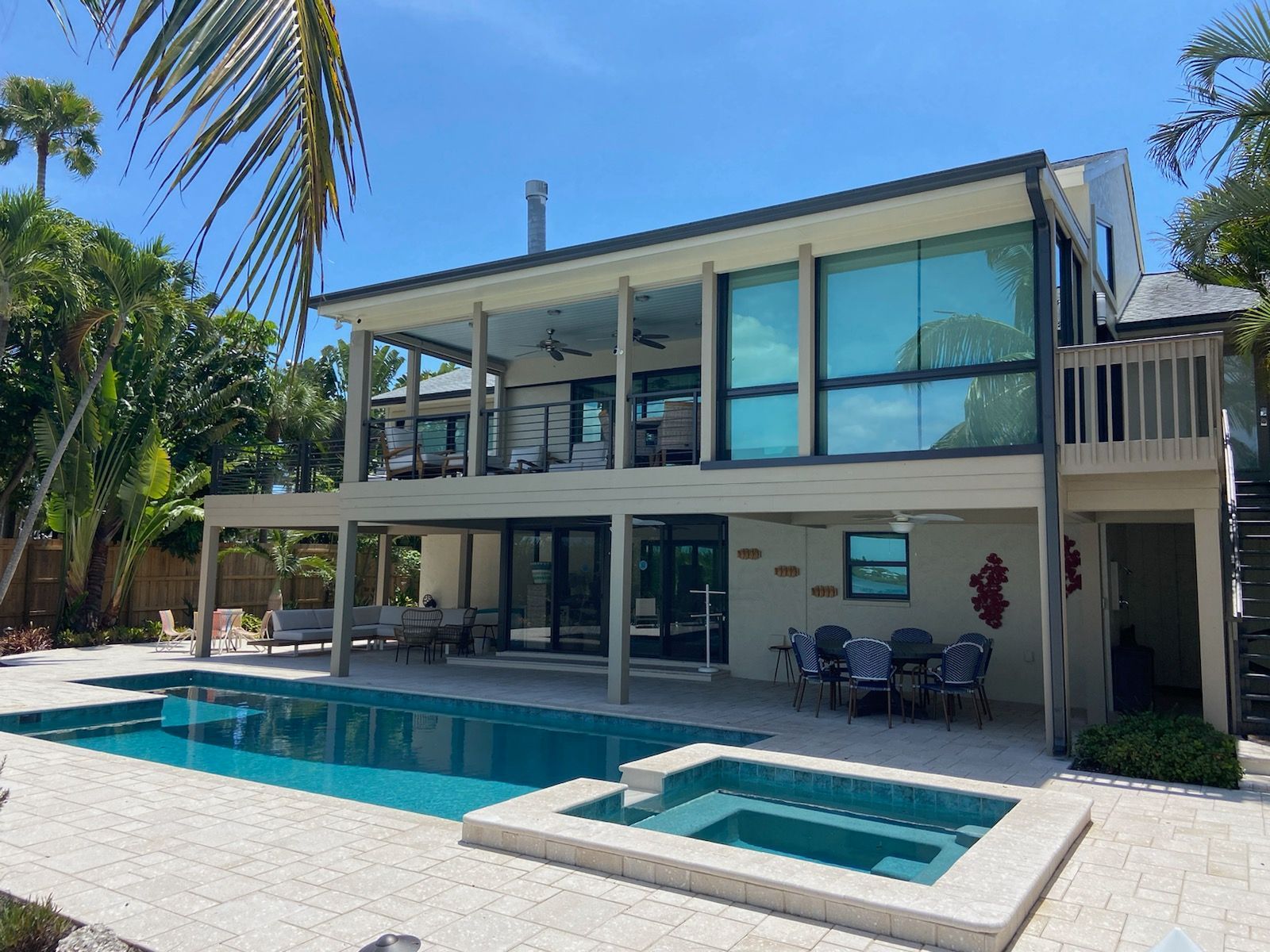 A large house with a large swimming pool and a hot tub.