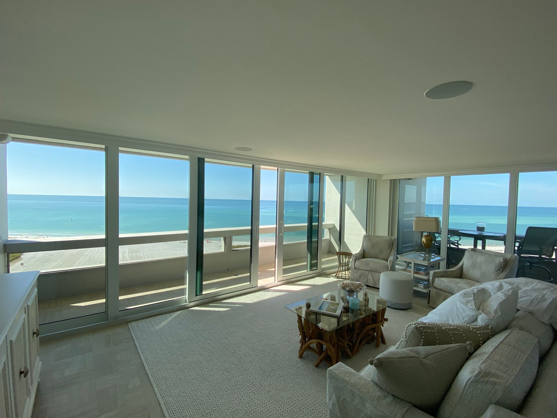 A living room with a view of the ocean
