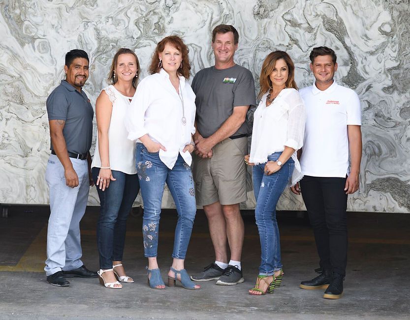 A group of people are posing for a picture together