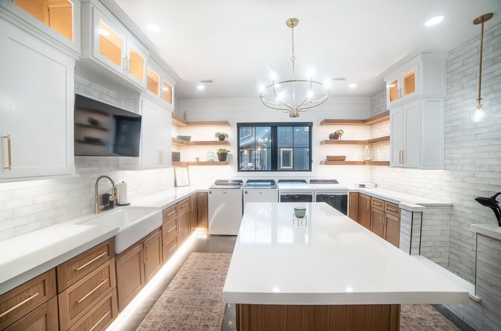 There is a large island in the middle of the kitchen.