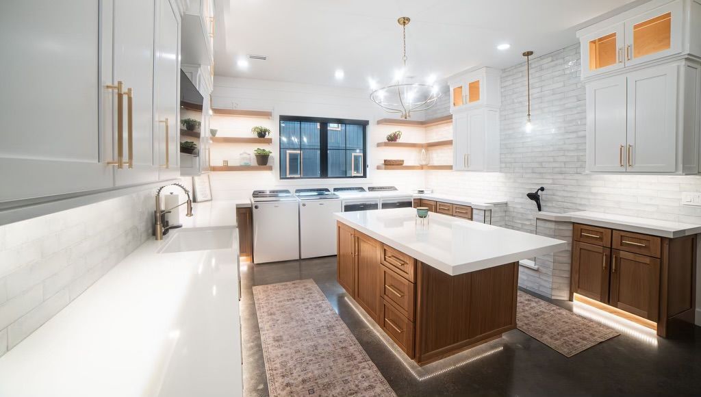 There is a large island in the middle of the kitchen.