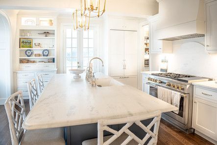 There is a large island in the middle of the kitchen.