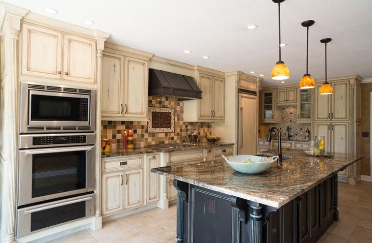 There is a large island in the middle of the kitchen.
