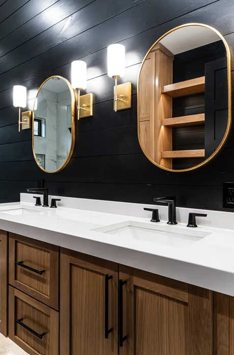 A bathroom with two sinks and two mirrors.