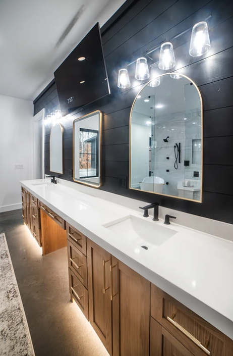 A bathroom with two sinks and two mirrors.