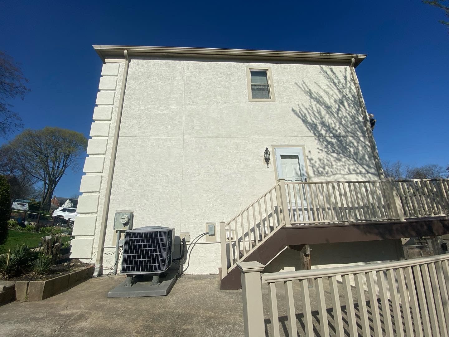A large white building with stairs leading up to it