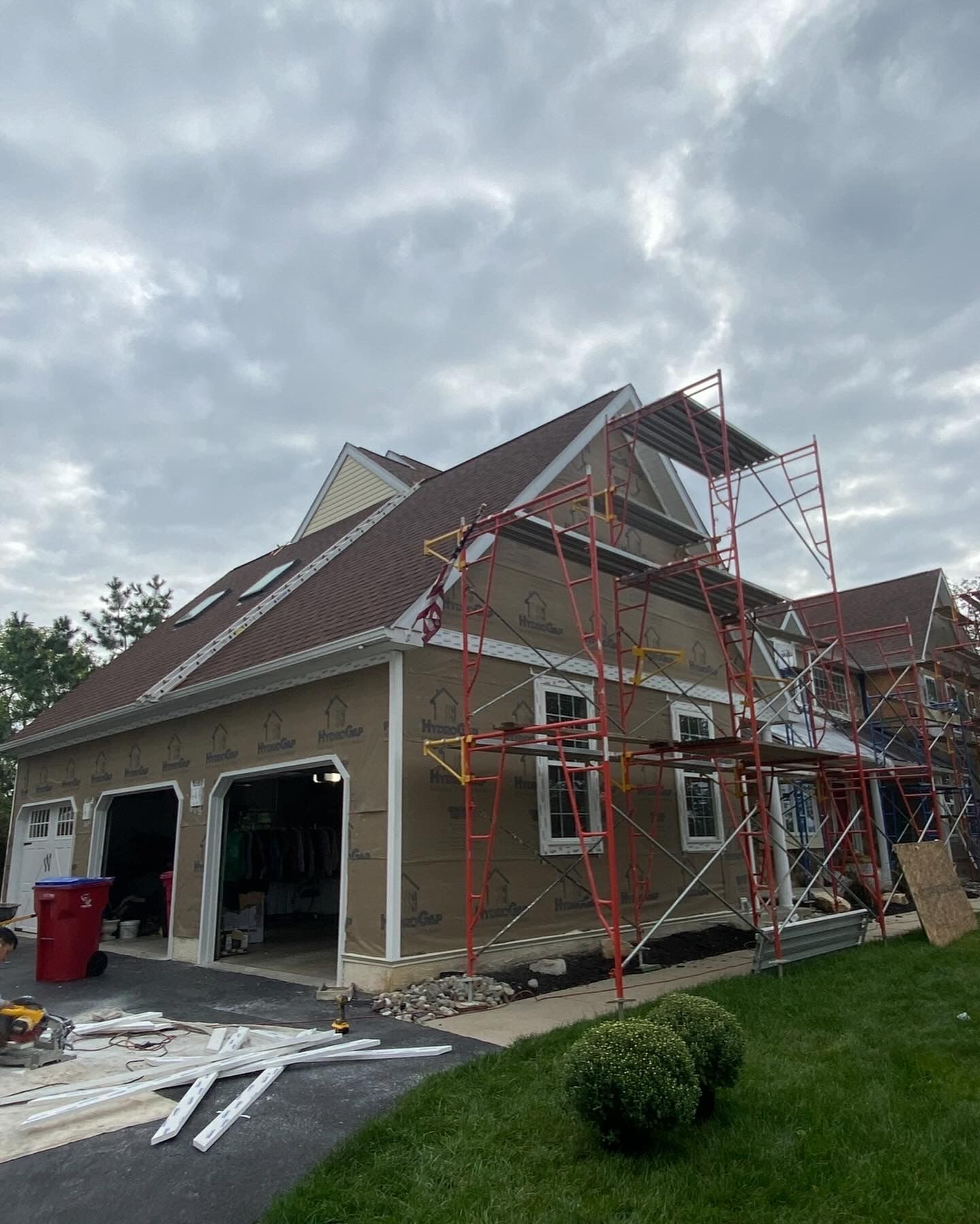 A house is being remodeled with scaffolding around it.
