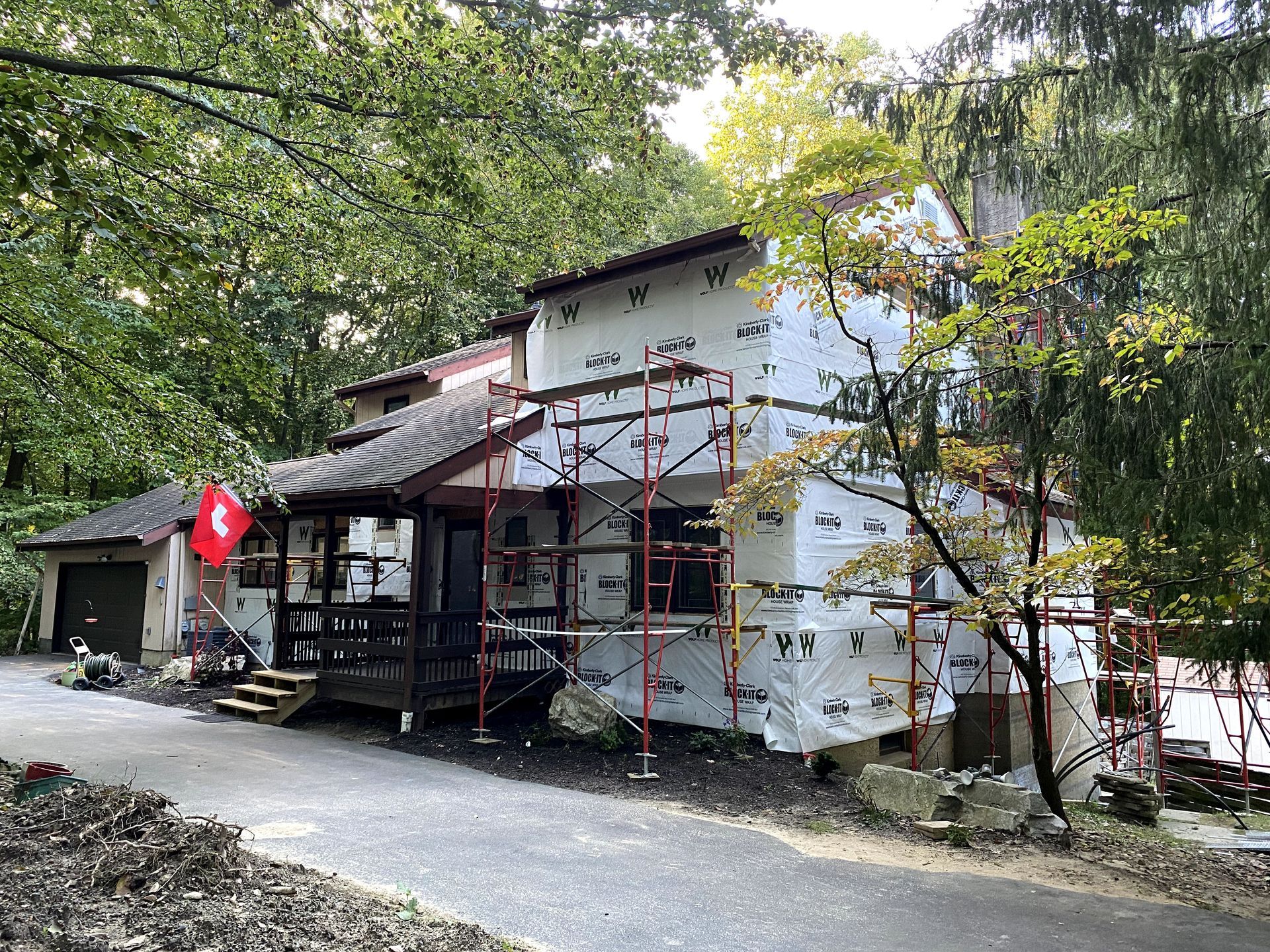 A house is being remodeled with scaffolding around it.