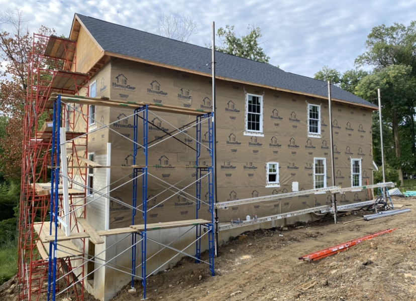 A house is being built with scaffolding around it.