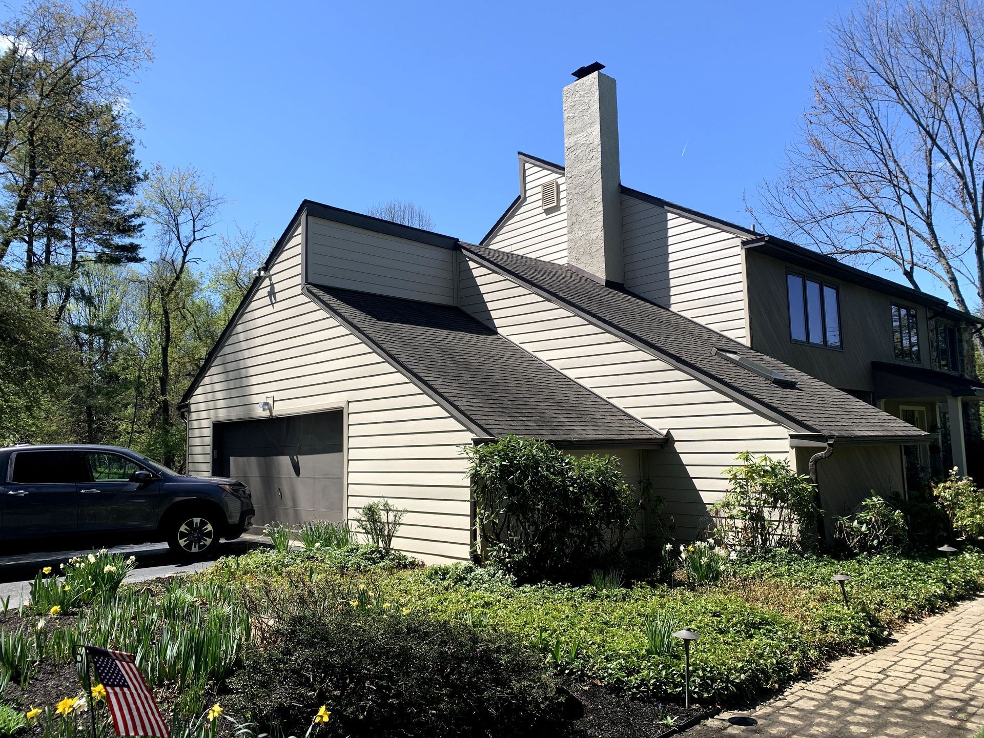 A house with a car parked in front of it