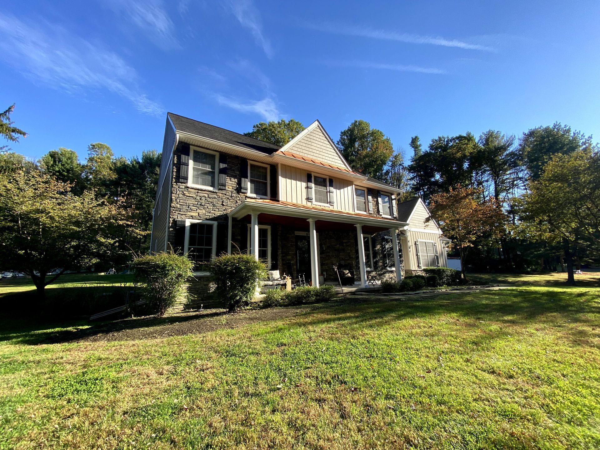 A large house with a large lawn in front of it