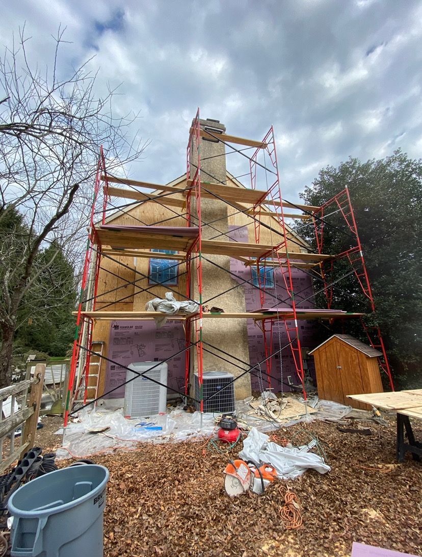 A house is being built with scaffolding around it.