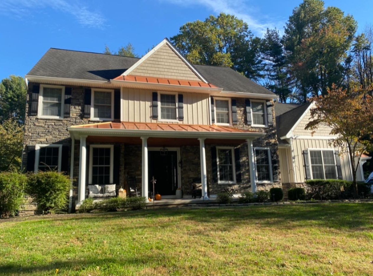A large house with a large lawn in front of it.