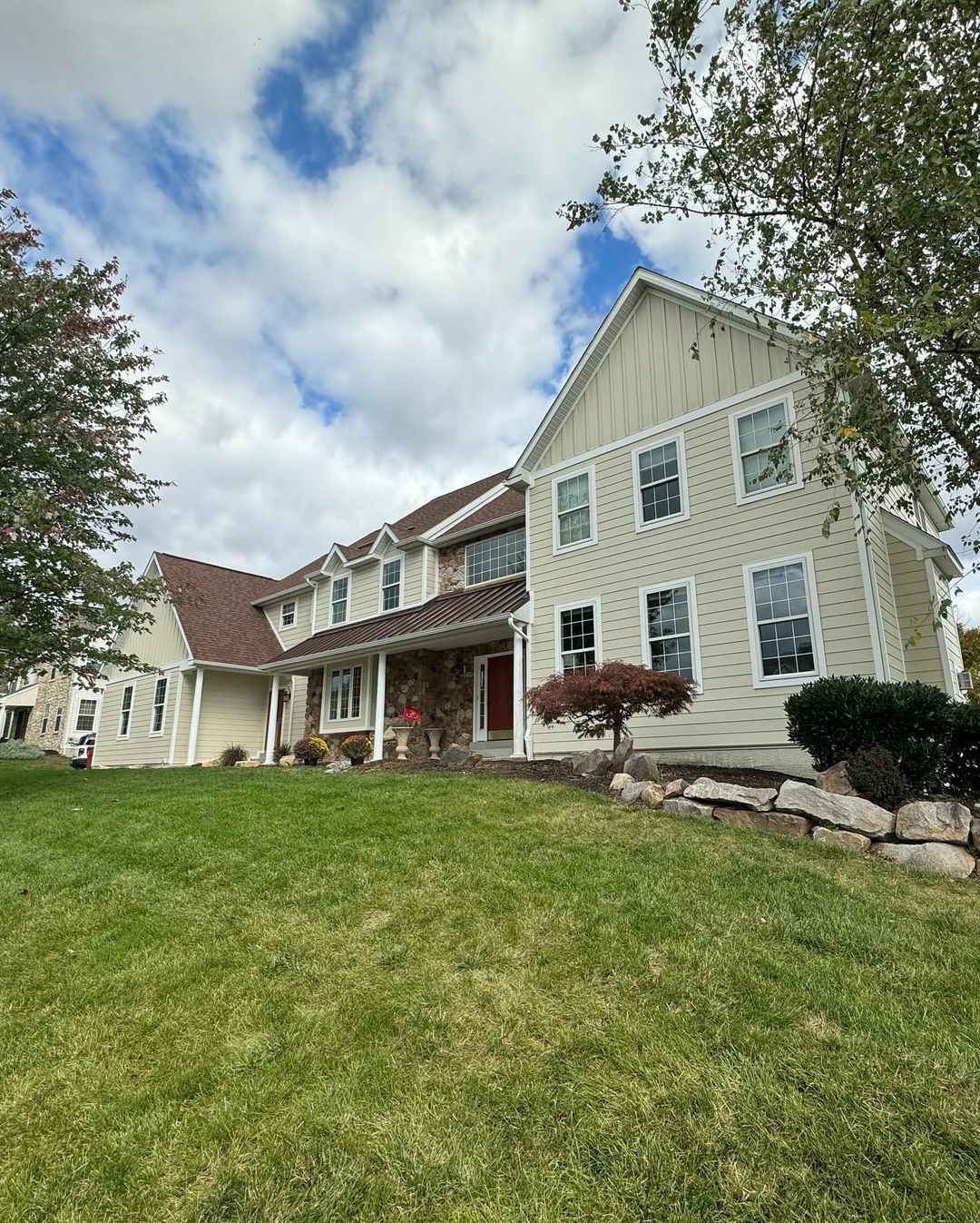 A large house with a large lawn in front of it