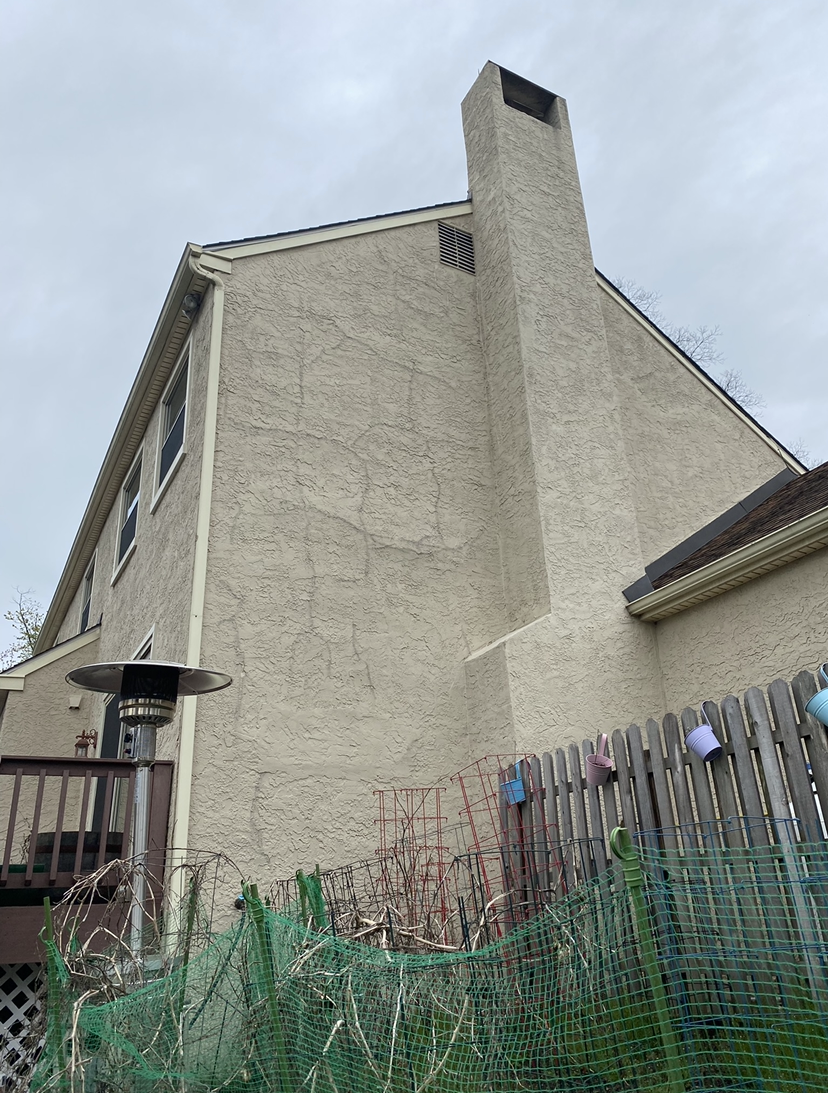 A  chimney on the side of a house