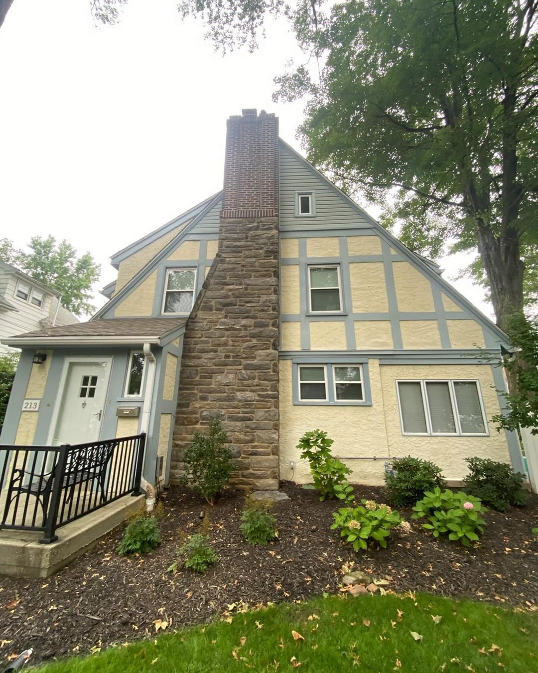 A house with a chimney on the side of it